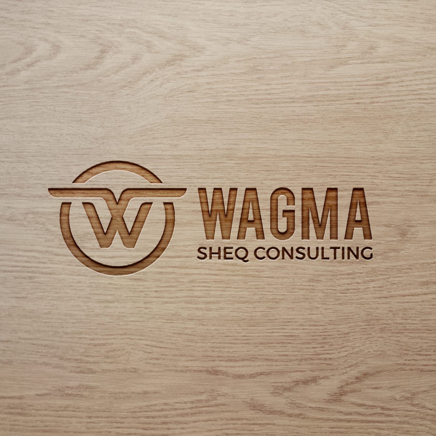 The Wagma SHEQ Consulting logo engraved in wood